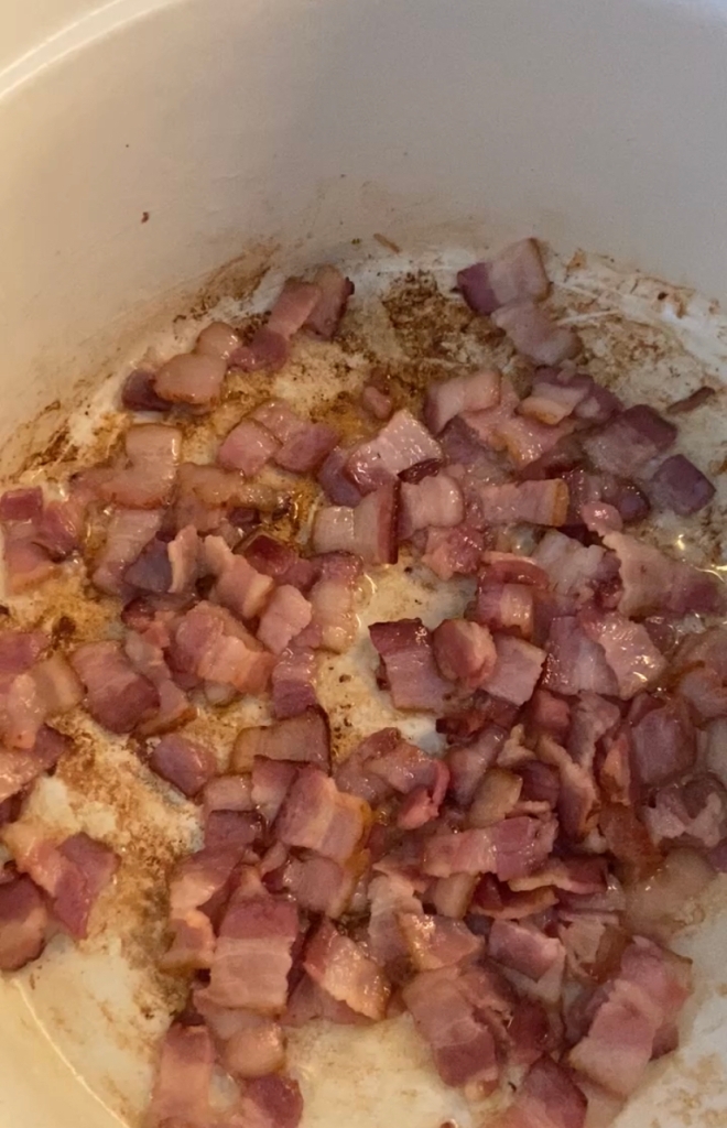bacon cooking in a pot for potato soup